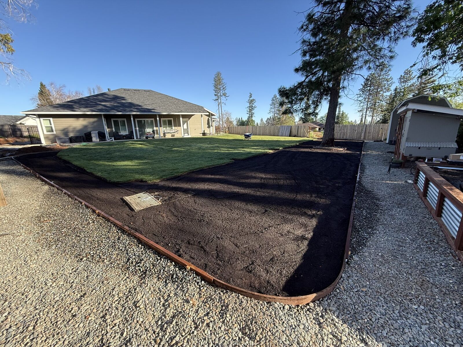 Bare beds and edges before mulch and bed cleanup