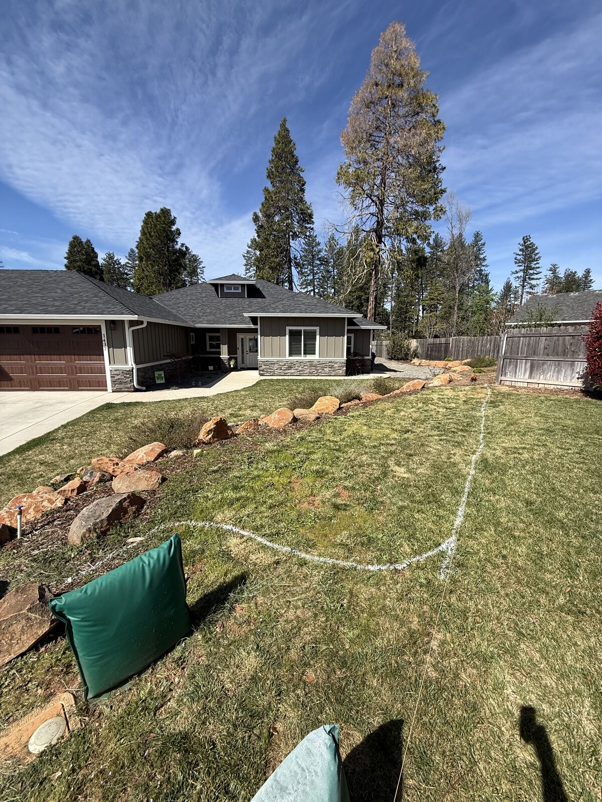 Patchy front yard before regular lawn maintenance
